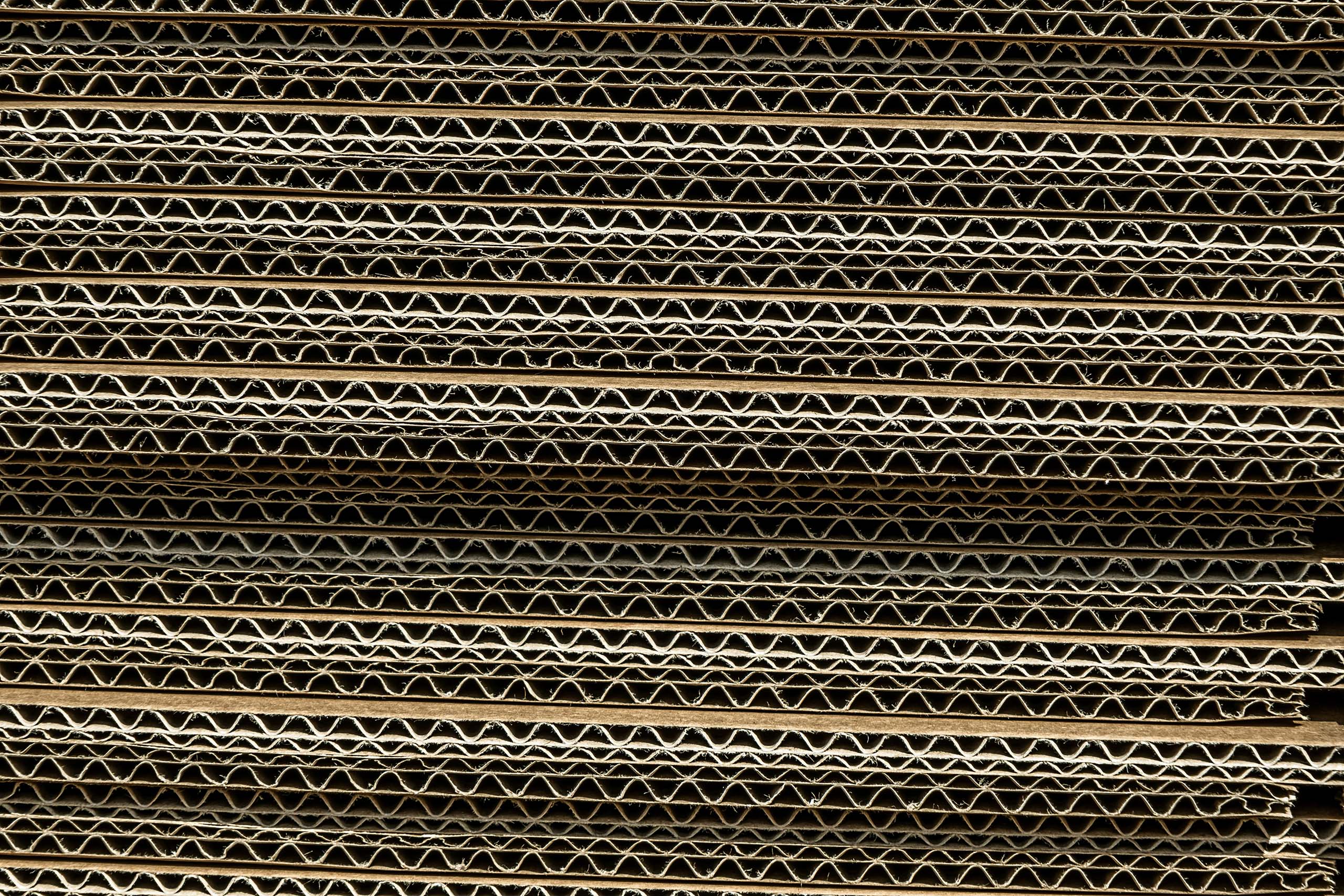 Close-up of a stack of corrugated cardboard sheets